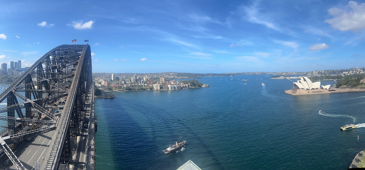 Sydney harbor and the Sydney Opera House as photographed from the pylon overlook and the Sydney Harbor Bridge.
