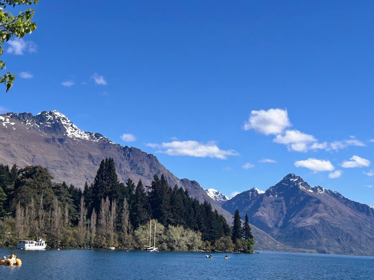 New Zealand's snow capped southern Alps rise over the Queenstown Botnical Gardens