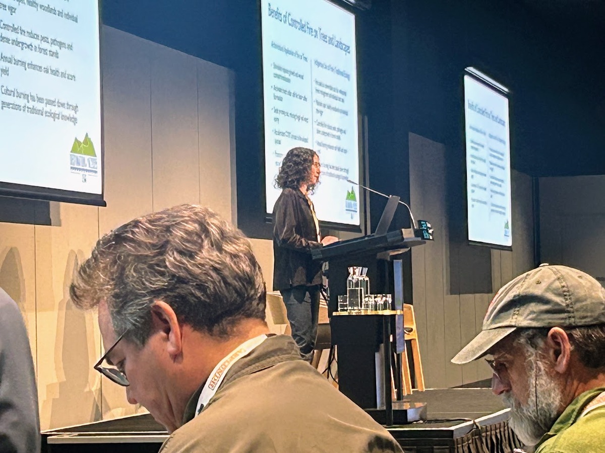 ISA Certified Arborist Sprout Weinberger speaking on the ground breaking work she is doing to induce positive wound closure responses in fire adapted tree species with fire. 